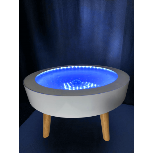 Round light-up side table, white base and wooden legs, blue illuminated top