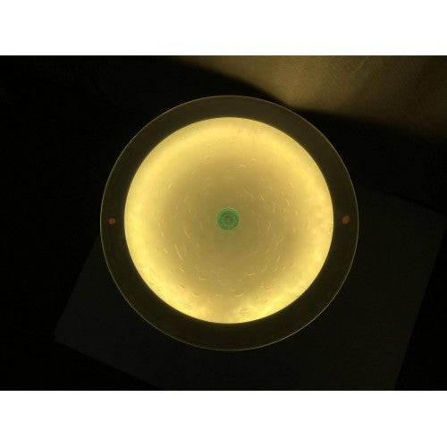 Round light-up side table top with warm yellow circular LED ring glow