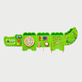 Green crocodile-shaped activity wall panels with maze, gears, beads, and number board