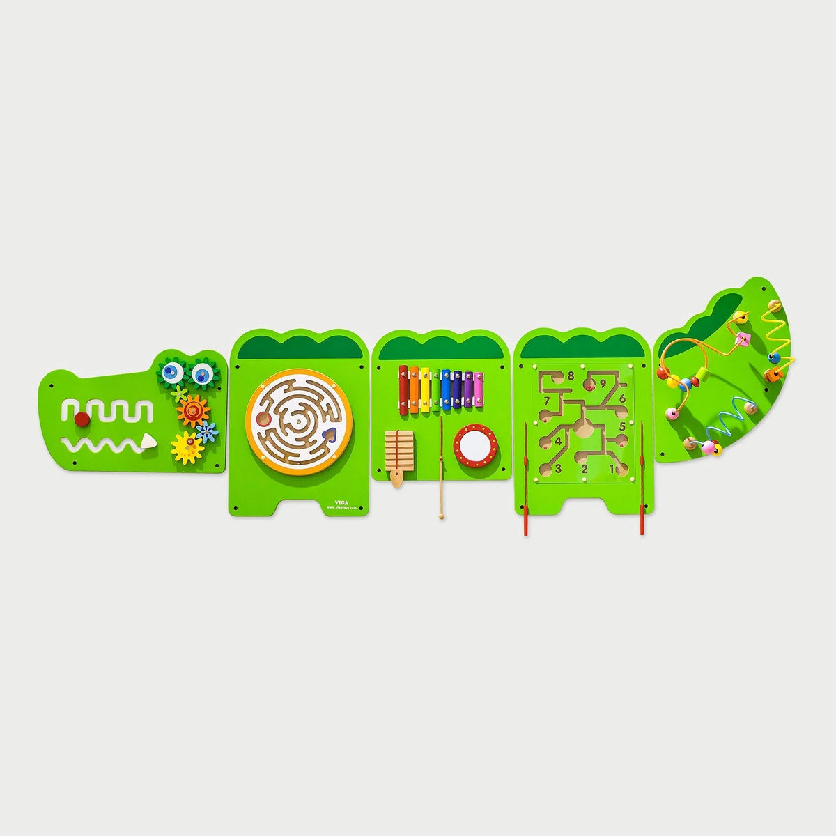 Green crocodile-shaped activity wall panels with maze, gears, beads, and number board