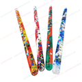 Set of four jumbo glitter tubes in red, green, yellow, and blue with confetti