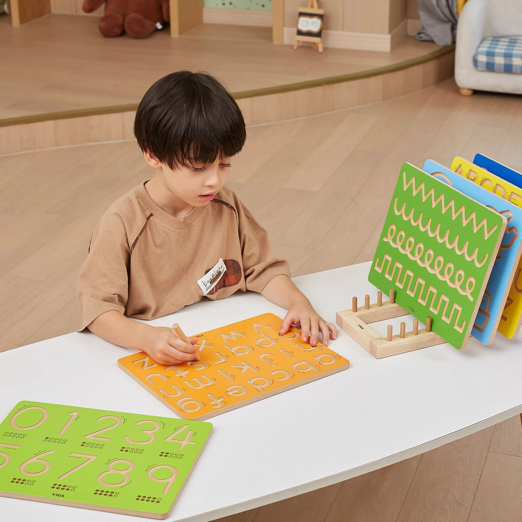 Lowercase letter tracing boards in orange and green with dotted guide rows