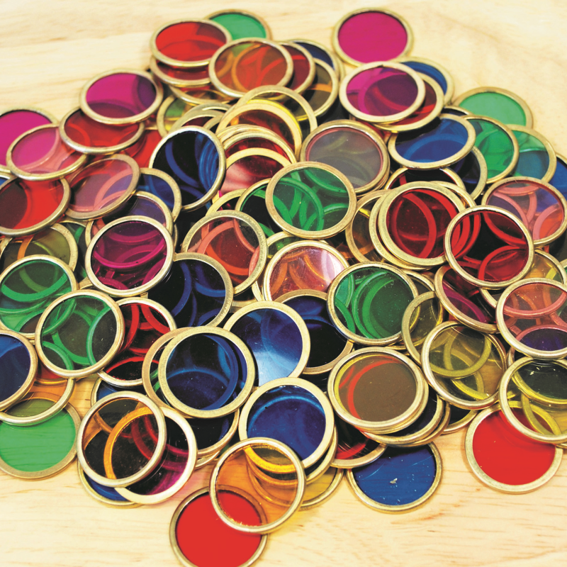 Round metal counting chips with colorful center in assorted red, green, blue and gold rims