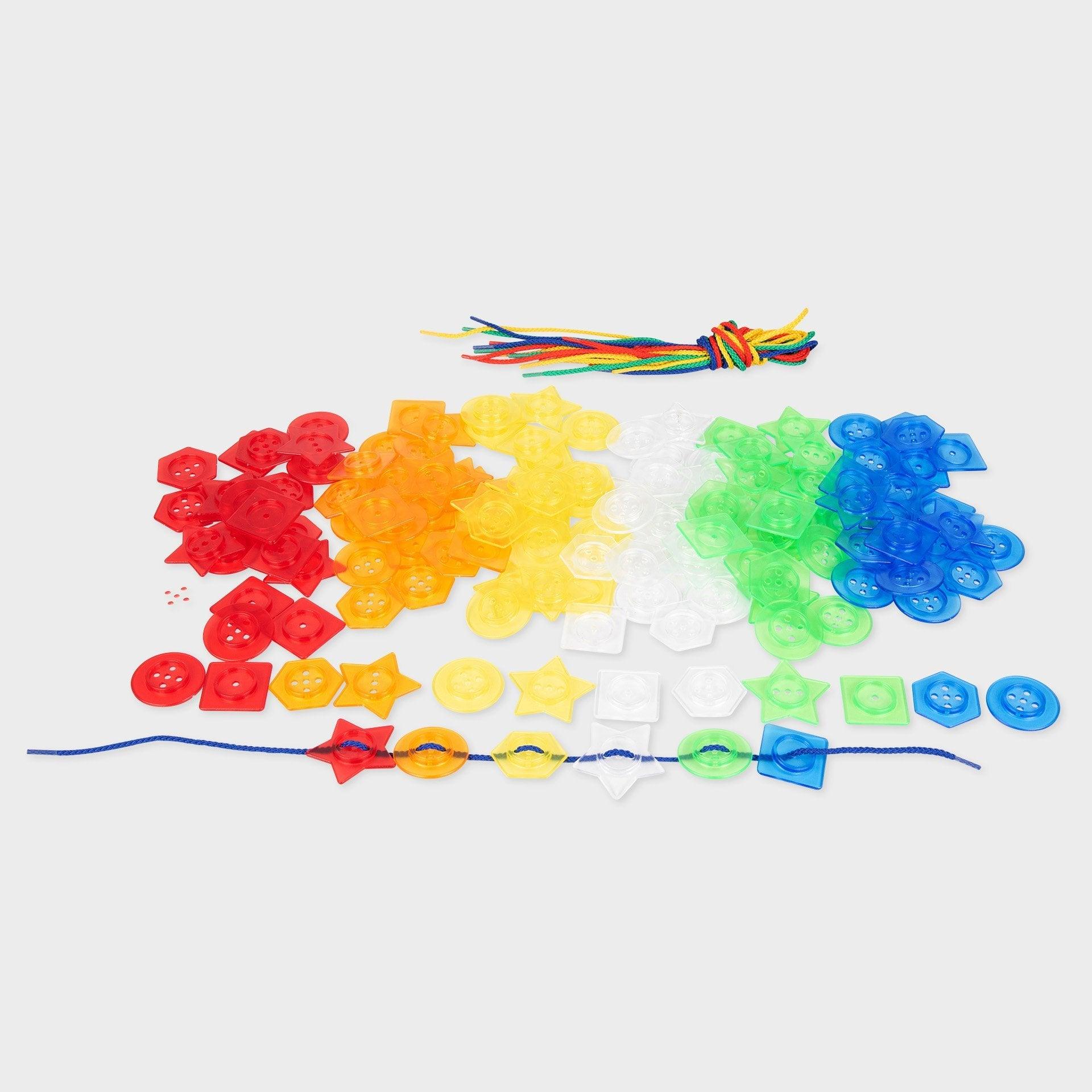 Translucent stackable buttons assortment in red, yellow, green, and blue shapes