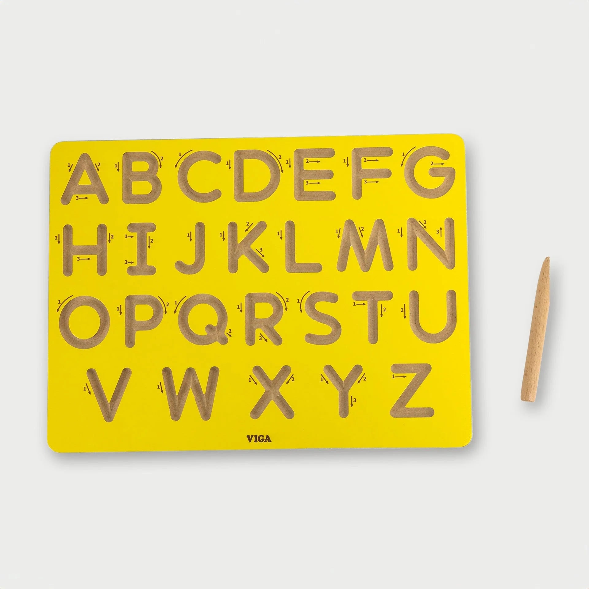 Yellow uppercase letter tracing board with molded A–Z grooves and guide lines