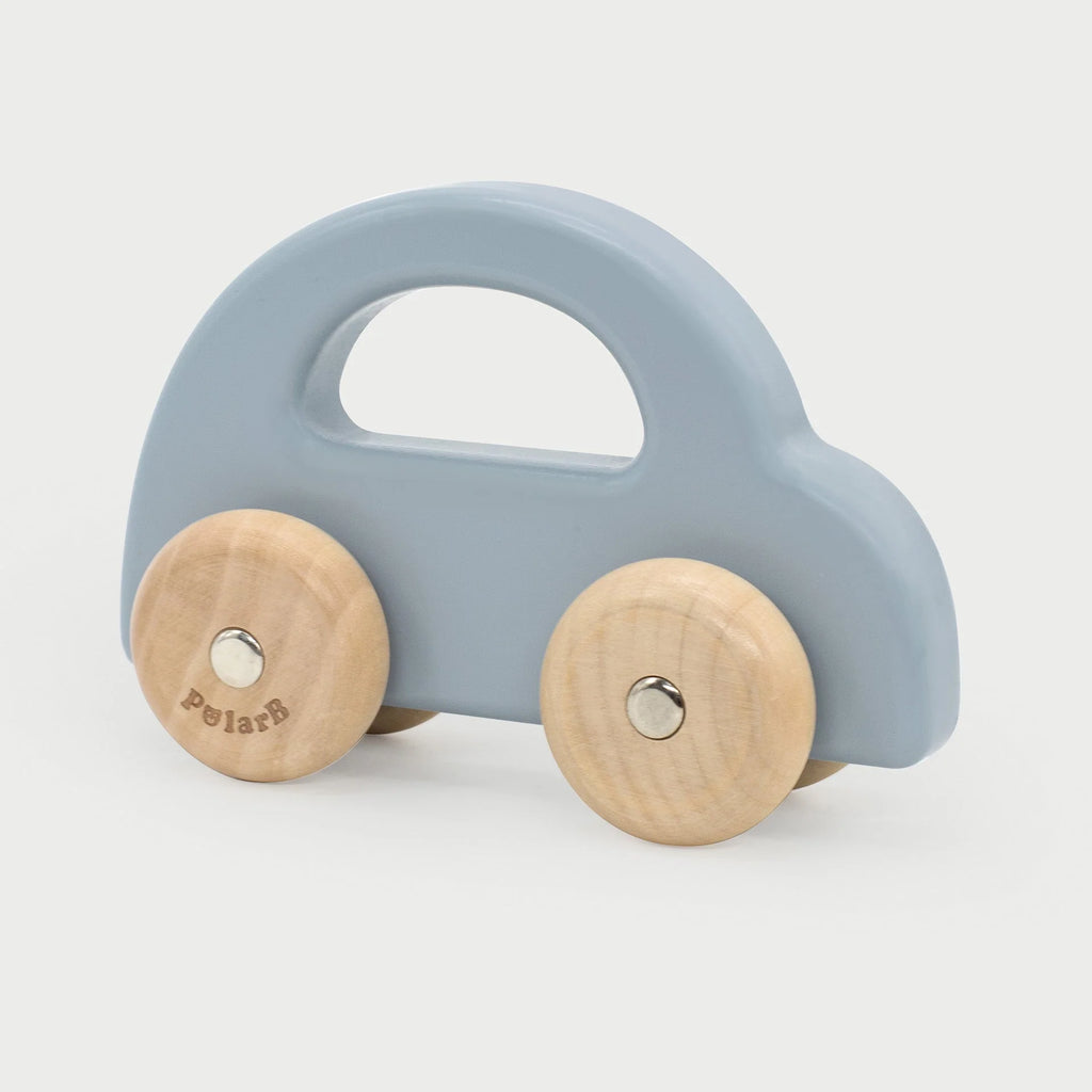 Blue wooden push car with two round wooden wheels and a top carry handle