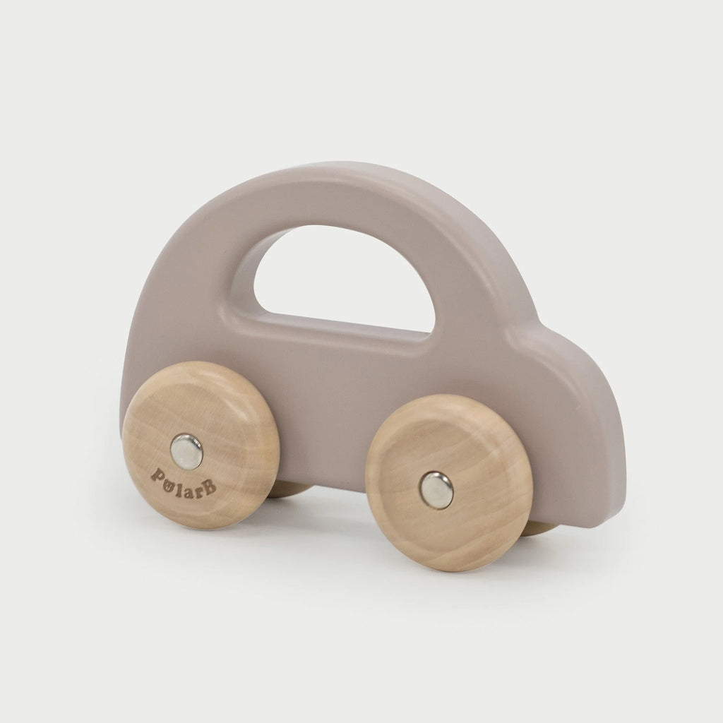 Light brown wooden toy car with 2 round wheels, top handle cutout; PolarAB logo