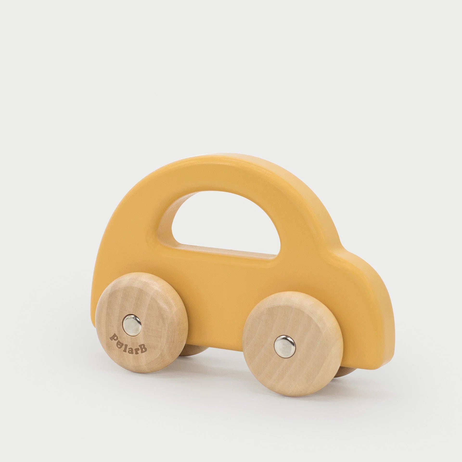 Yellow wooden toy car with rounded body and wooden wheels