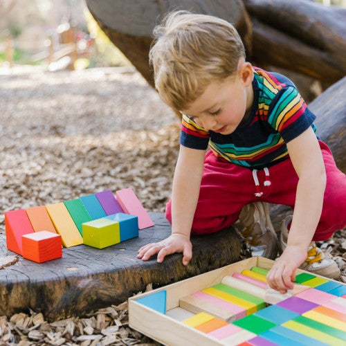 Colorful wooden block tray with multicolored square pieces