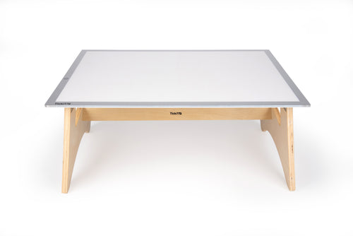 Light panel table set with gray-edged white panel and light wood legs