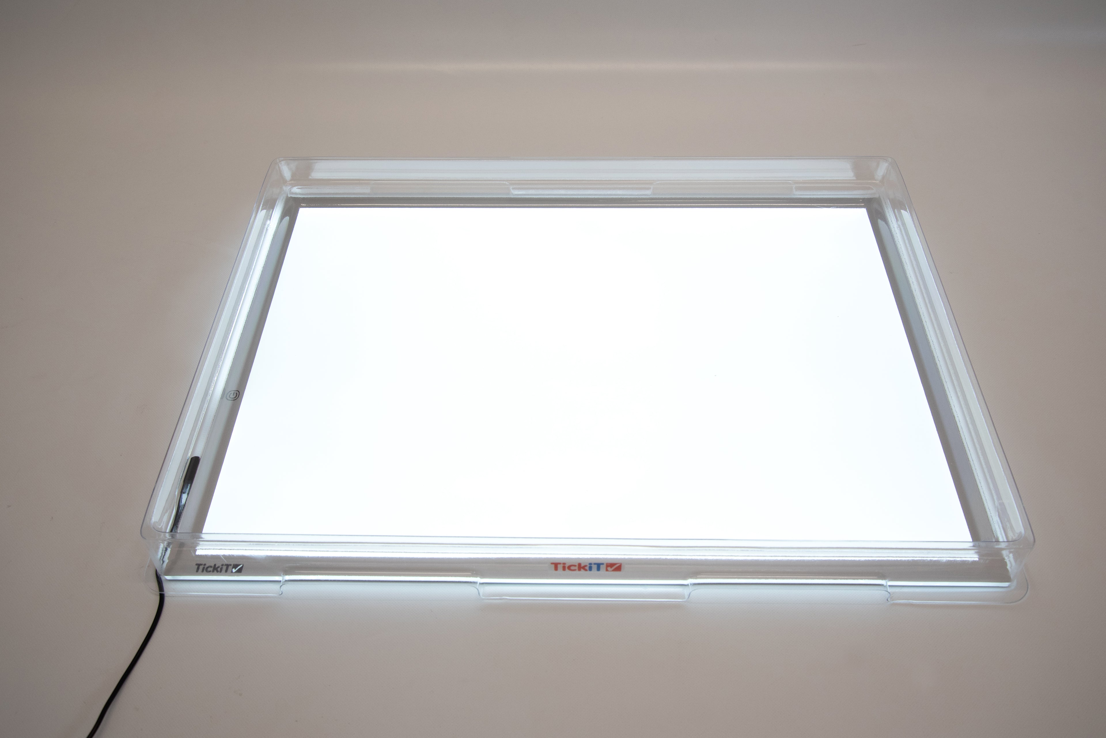 Clear acrylic light panel cover with empty illuminated window and visible side tabs