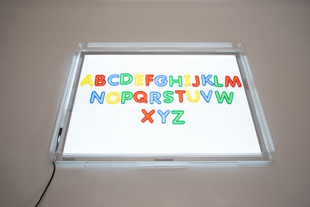 Transparent light panel cover with colorful alphabet letters displayed on the illuminated window