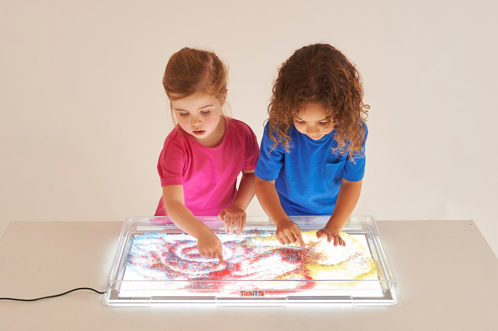 Transparent light panel cover showing colorful illuminated artwork beneath the clear window