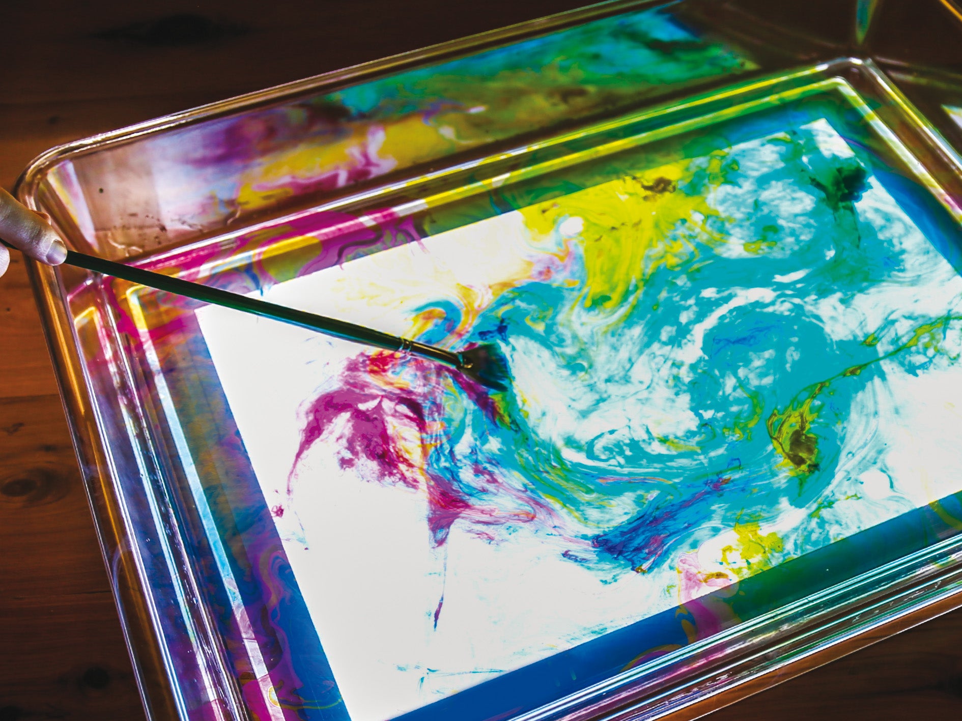 Clear light-up art tray with glowing multicolor background pattern