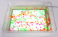 Clear light-up art tray with green and orange dot pattern