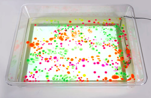 Clear light-up art tray with green and orange dot pattern
