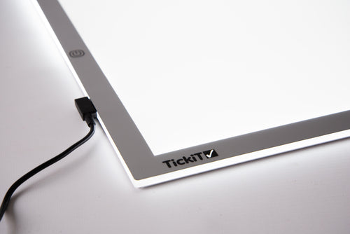 A3 light panel corner with TickiT label and power cable