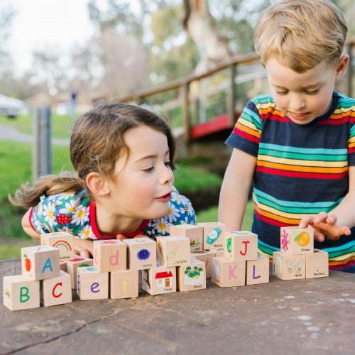 Wooden alphabet block set with colorful letter tiles and A–L cubes