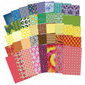 Assorted patterned fabric paper sheets, colorful designs, scrapbook-style stack