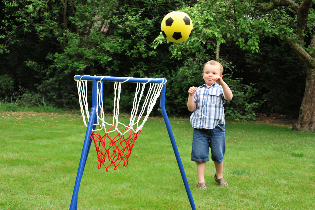 Blue basketball hoop stand with red net on a backyard lawn