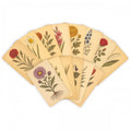 Set of botanical rubbing plates with vintage flower and leaf designs on kraft paper