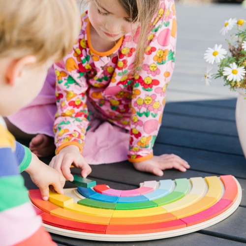 Rainbow building toy with colorful curved pieces for stacking and play