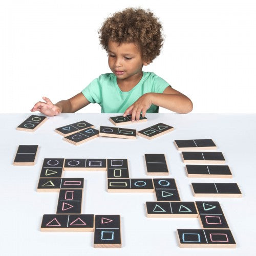 Chalk domino set with black tiles and white chalk-style symbols, arranged for play