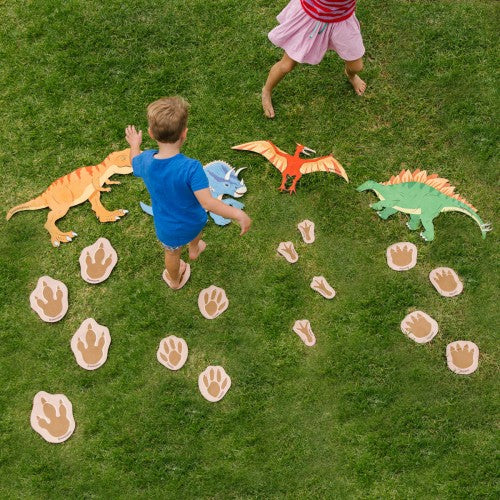 Colorful dinosaur and footprint play set with cutout figures on a flat surface