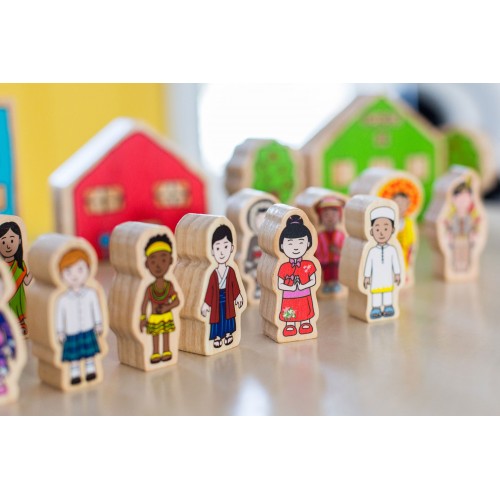 Set of colorful wooden children figurines with printed clothing, on small bases