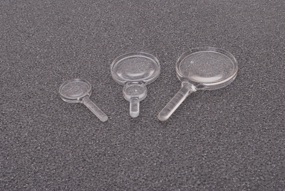 Set of clear plastic hand magnifiers with round lenses and short handles