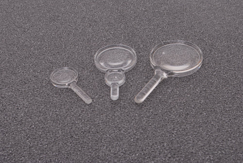 Set of clear plastic hand magnifiers with round lenses and short handles