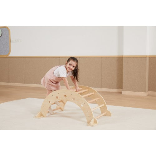 Wooden climbing arch with multiple rung-like grips, set for kneeling play
