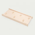 Wood climbing board with small handhold grips on top surface