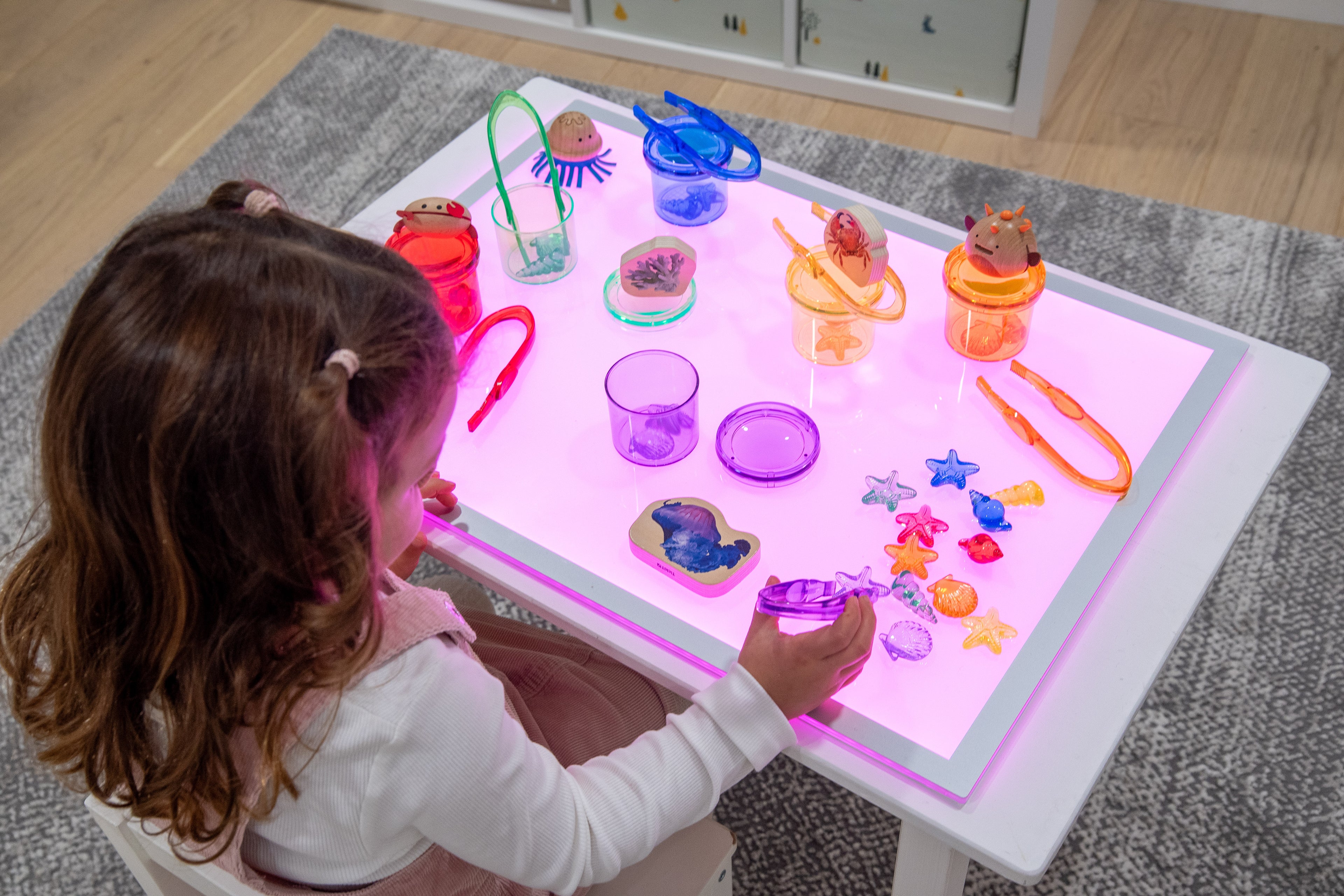 Rectangular color-changing light panel with pink glow and slim metal frame