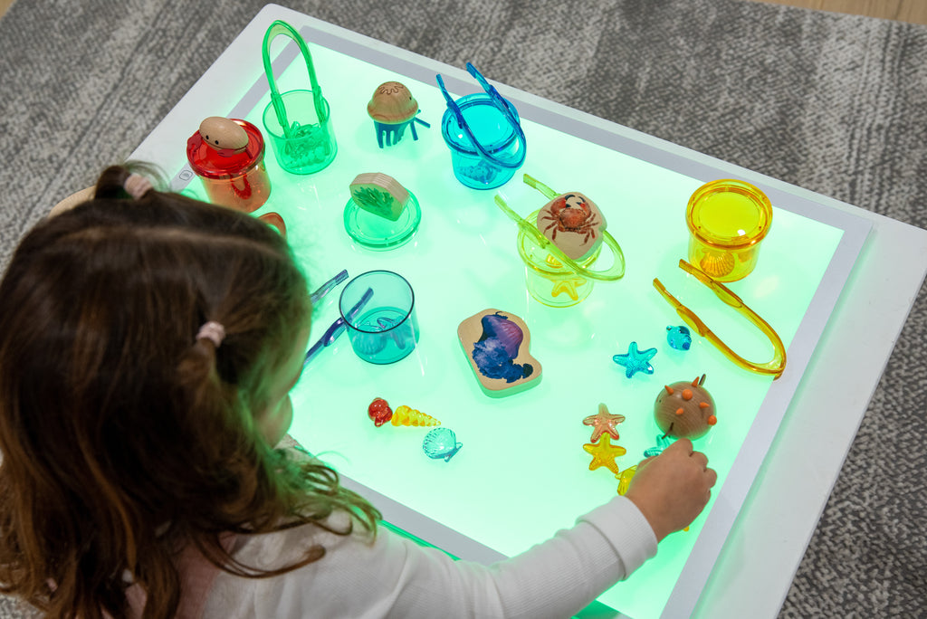 Rectangular color-changing light panel with bright green glow and slim metal frame