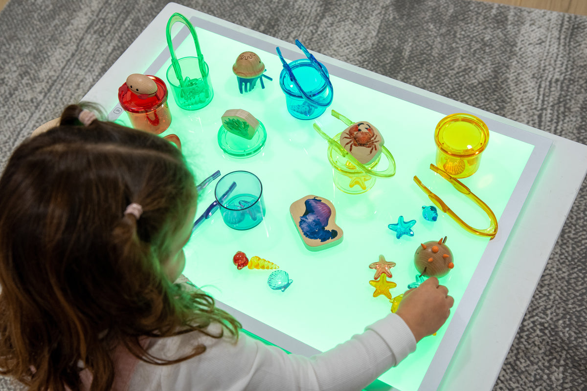 Rectangular color-changing light panel with bright green glow and slim metal frame