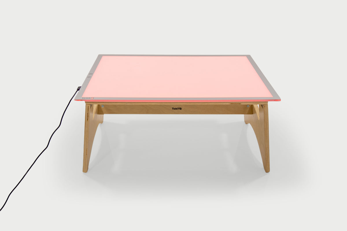 Color-changing light panel table set with rose-pink panel and natural wood frame