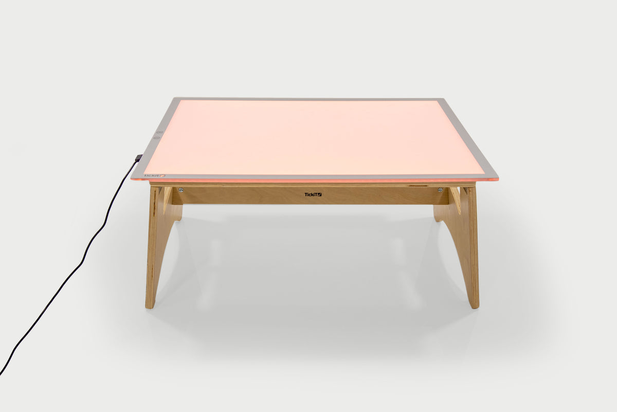 Color-changing light panel table set with pink panel and natural wood legs