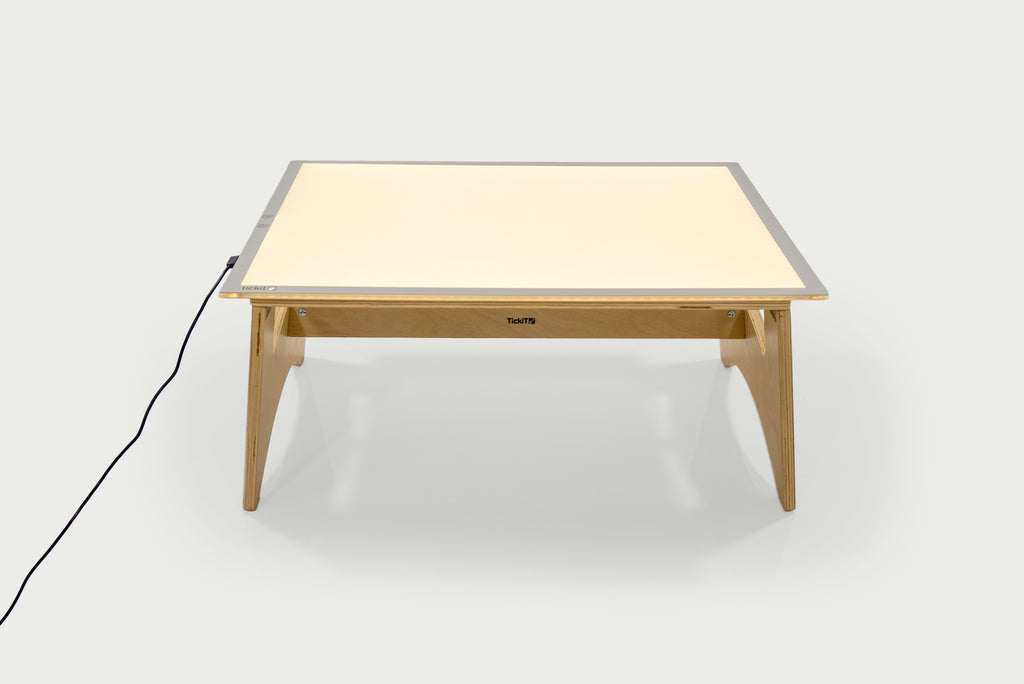 Color-changing light panel table set with warm white panel and natural wood frame