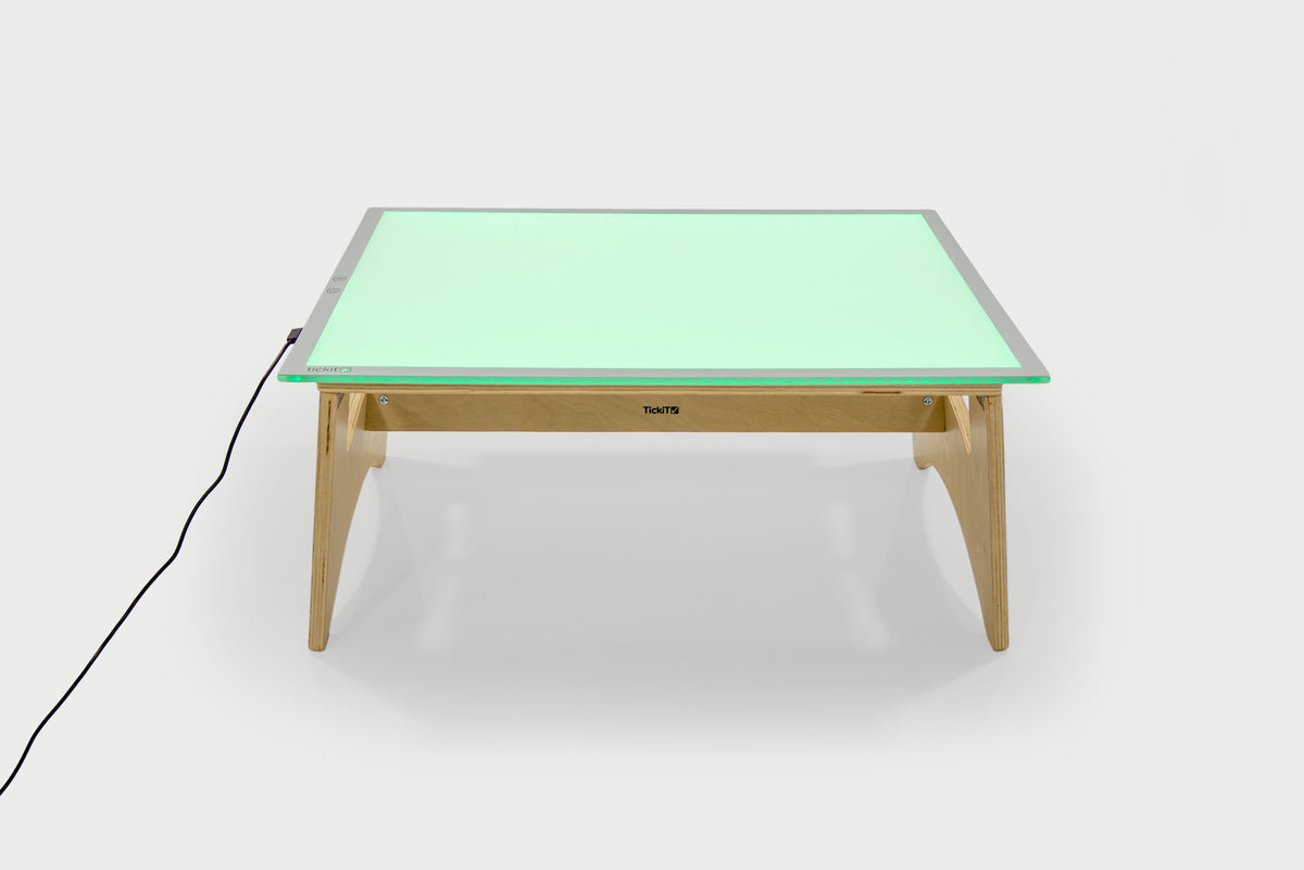 Color-changing light panel table set with green panel and natural wood legs