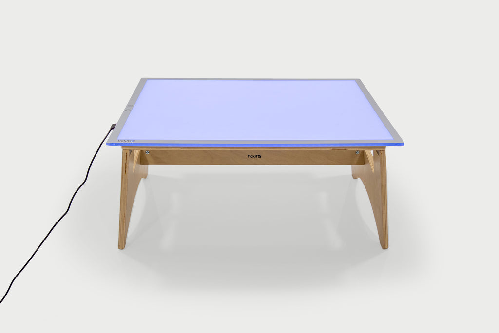 Color-changing light panel table set with blue panel and natural wood legs