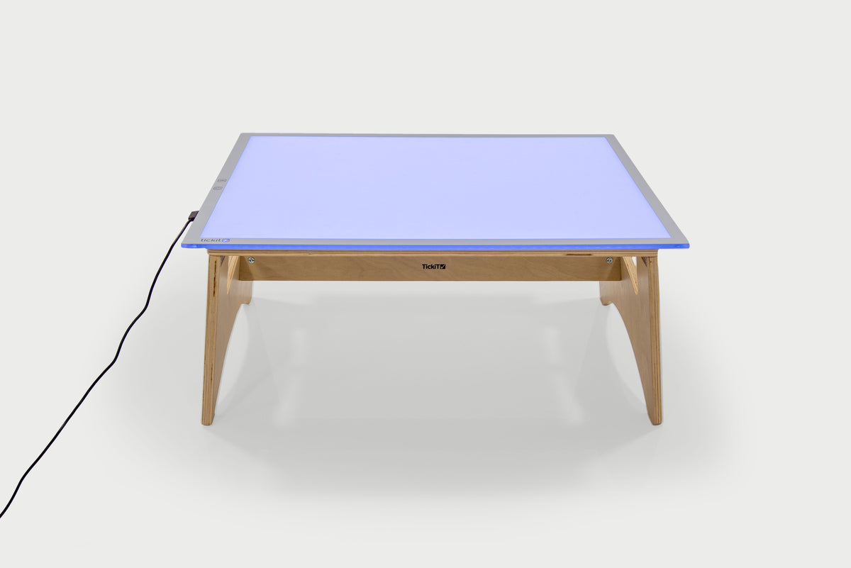Color-changing light panel table set with blue panel and natural wood legs