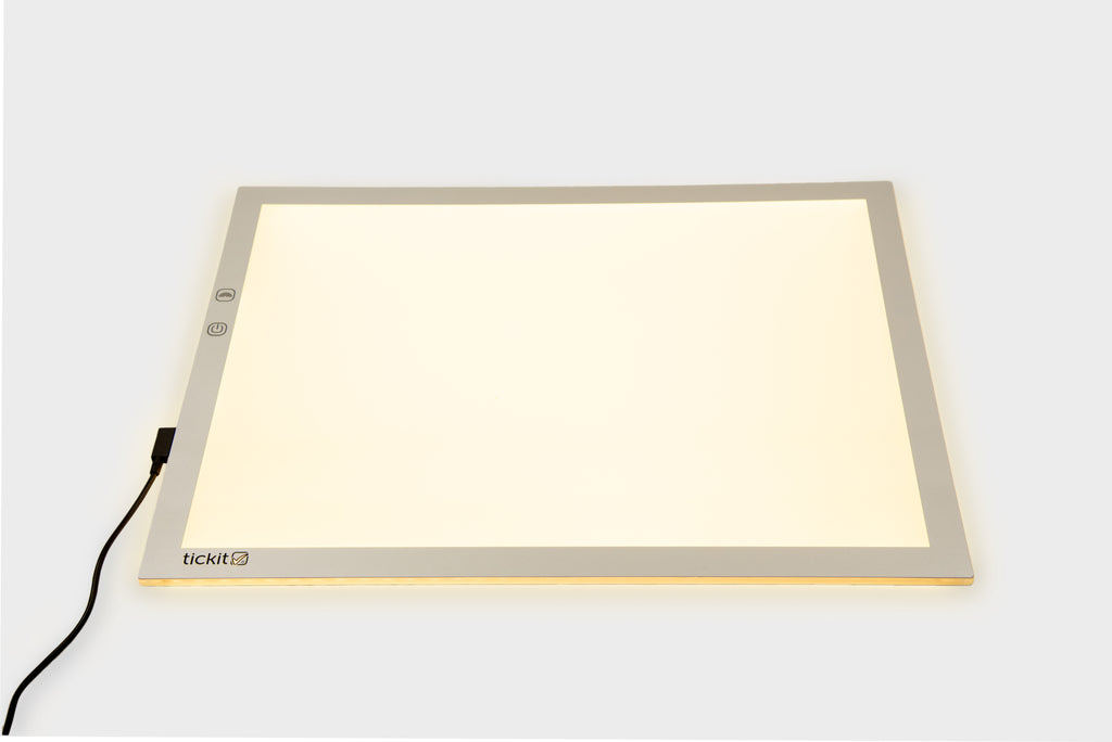 A3 color-changing light panel with black power cable, warm yellow glow