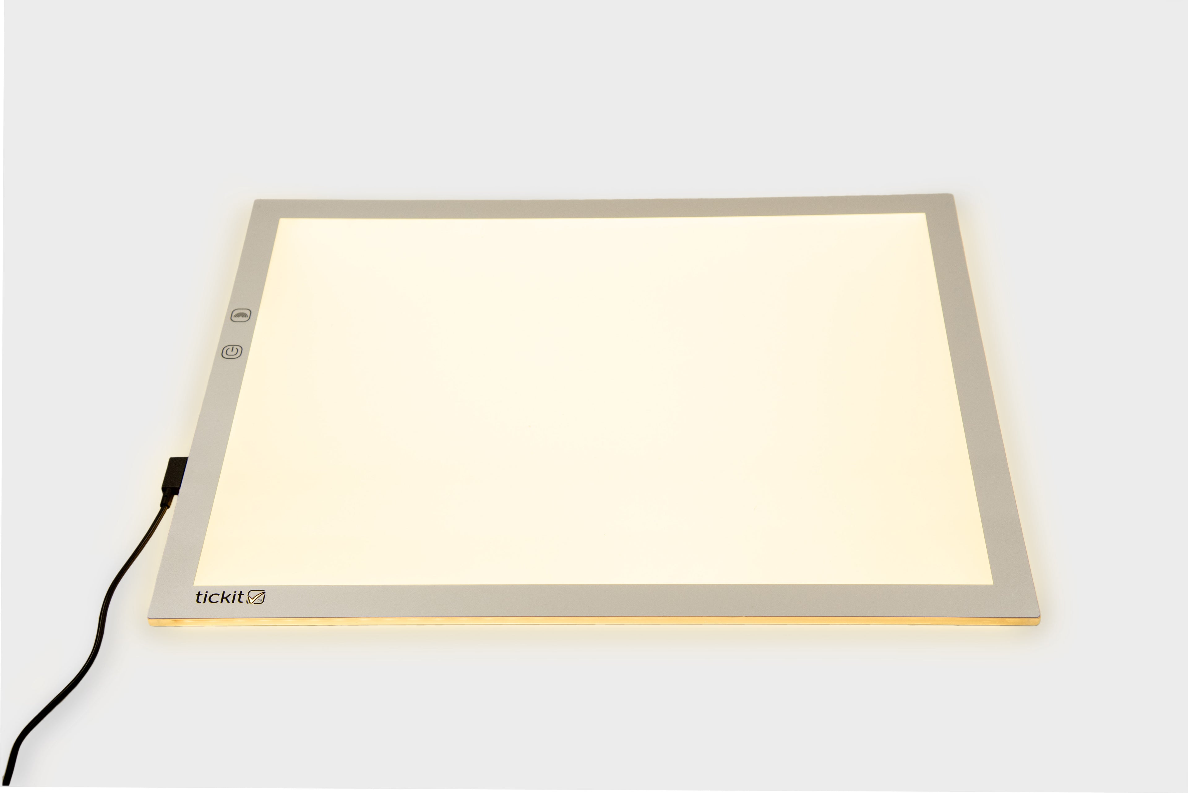 A3 color-changing light panel with black power cable, warm yellow glow