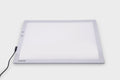 A3 color-changing light panel with black power cable, soft gray-white glow