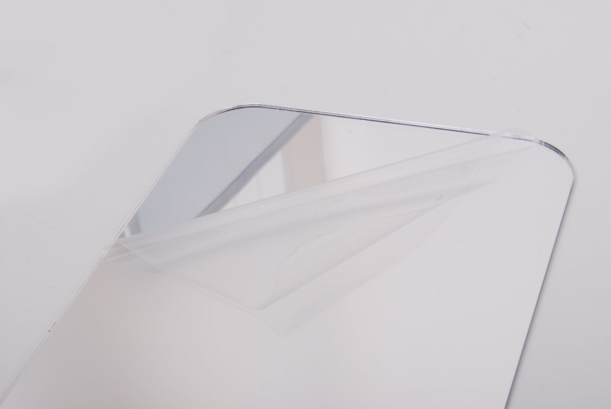 Clear crystal block with rounded edge and chrome-like frame