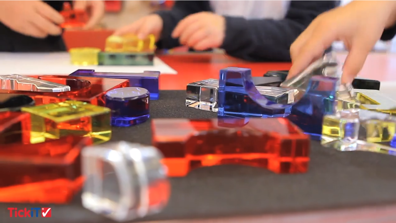 Colorful crystal building blocks set with geometric pieces arranged on a table