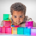 Color mixing boxes with multicolor translucent blocks, stacked in front