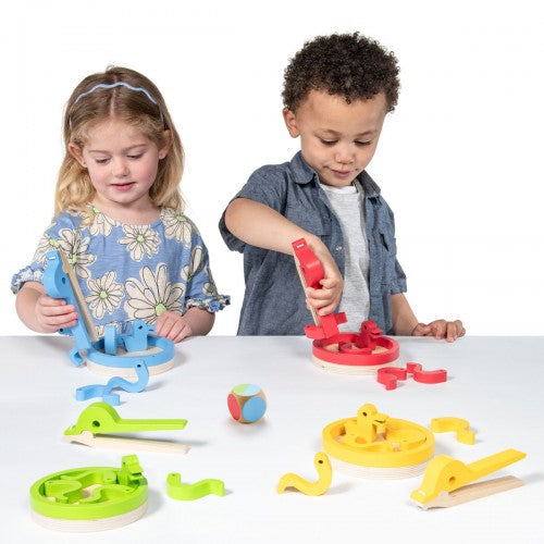 Color-sorting chick toy with yellow base, colorful pieces, and sorting pegs