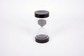 Black 30-minute sand timer with clear hourglass and round top lid